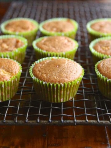 Paleo apple muffins cooling on a wire rack.