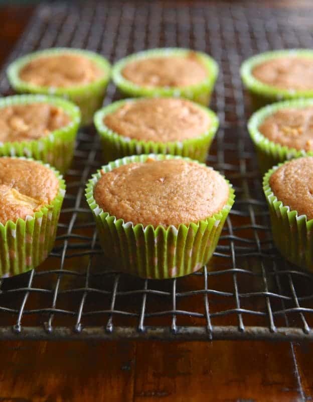 Paleo apple muffins cooling on a wire rack.