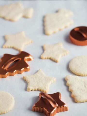 Gluten-free cut out cookies in the shape of a star, tree, and round.