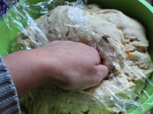 Punching gluten-free panettone dough.