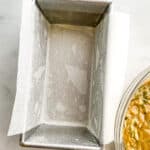 Loaf pan greased with oil and lined with parchment paper.