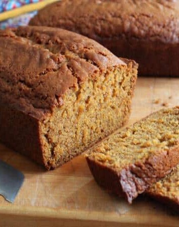 Gluten-Free Pumpkin Bread sliced on cutting board.