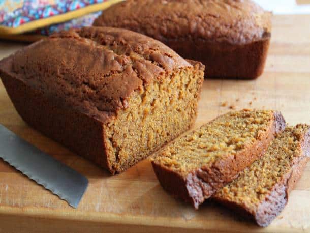 Gluten-Free Pumpkin Bread on a wood cutting board.