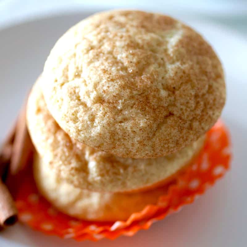 Pumpkin spice snickerdoodles on an orange cupcake liner.