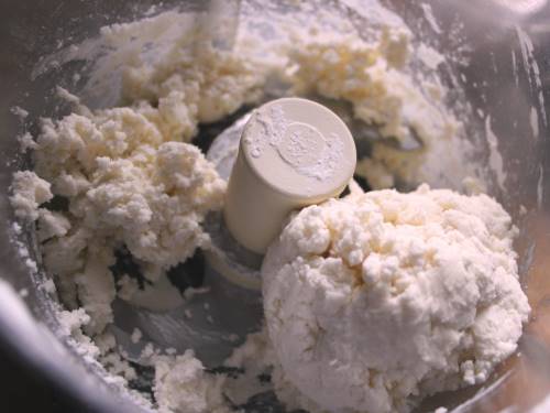 Gluten-free pie dough in a food processor bowl.