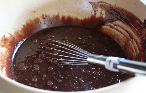 Gluten-free brownie batter whisked until smooth.