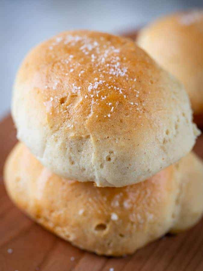 Two baked gluten-free soft dinner rolls. 