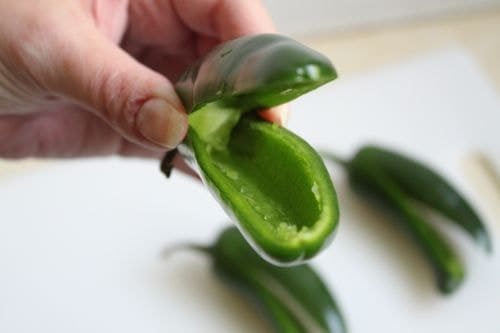 Jalapeño pepper sliced in half for filling.