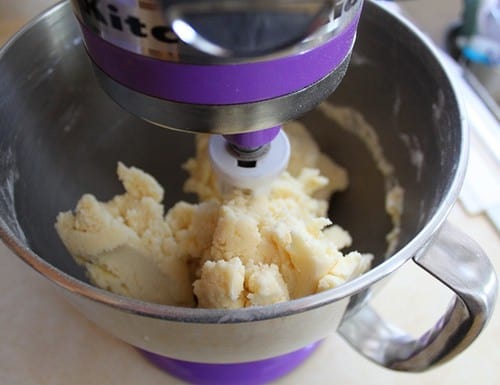 Smooth gluten-free cookie dough in the bowl of a stand mixer.