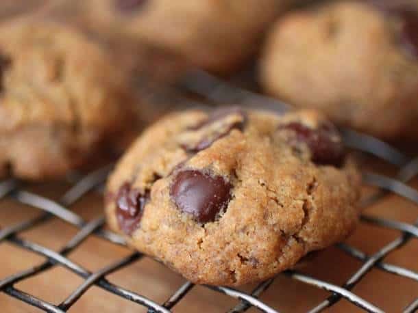 Vegan gluten-free chocolate chip cookie on a wire rack.