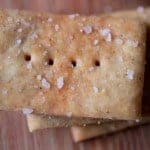 Whole grain gluten-free crackers with salt on top.