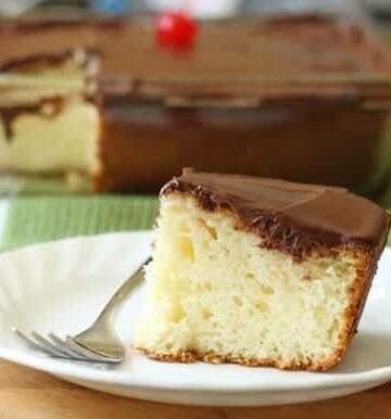 Gluten-Free Yellow Cake slice on white plate.